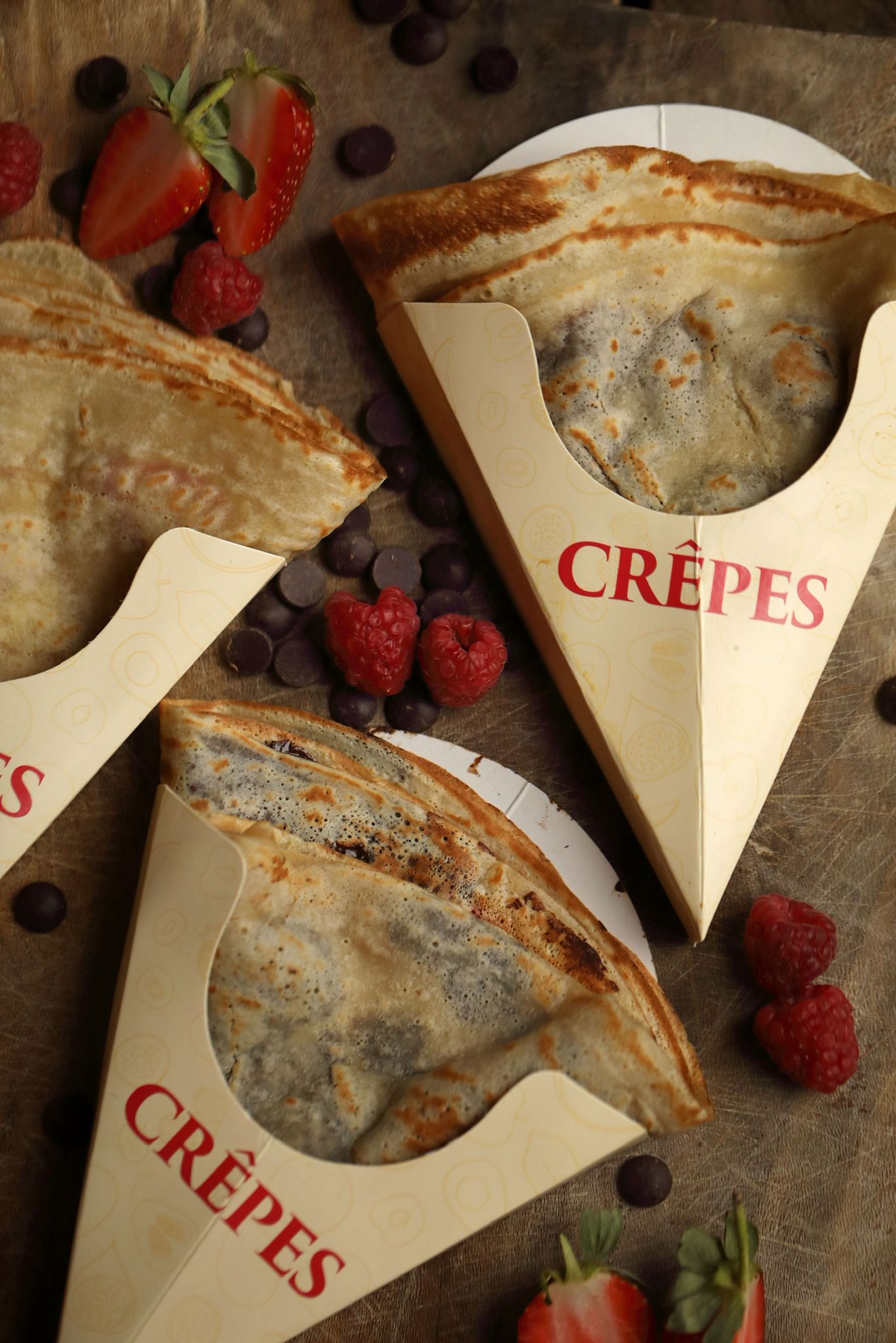 Darcey's Crepes — A tasty selection of crepes decorated with chocolate chips and raspberries